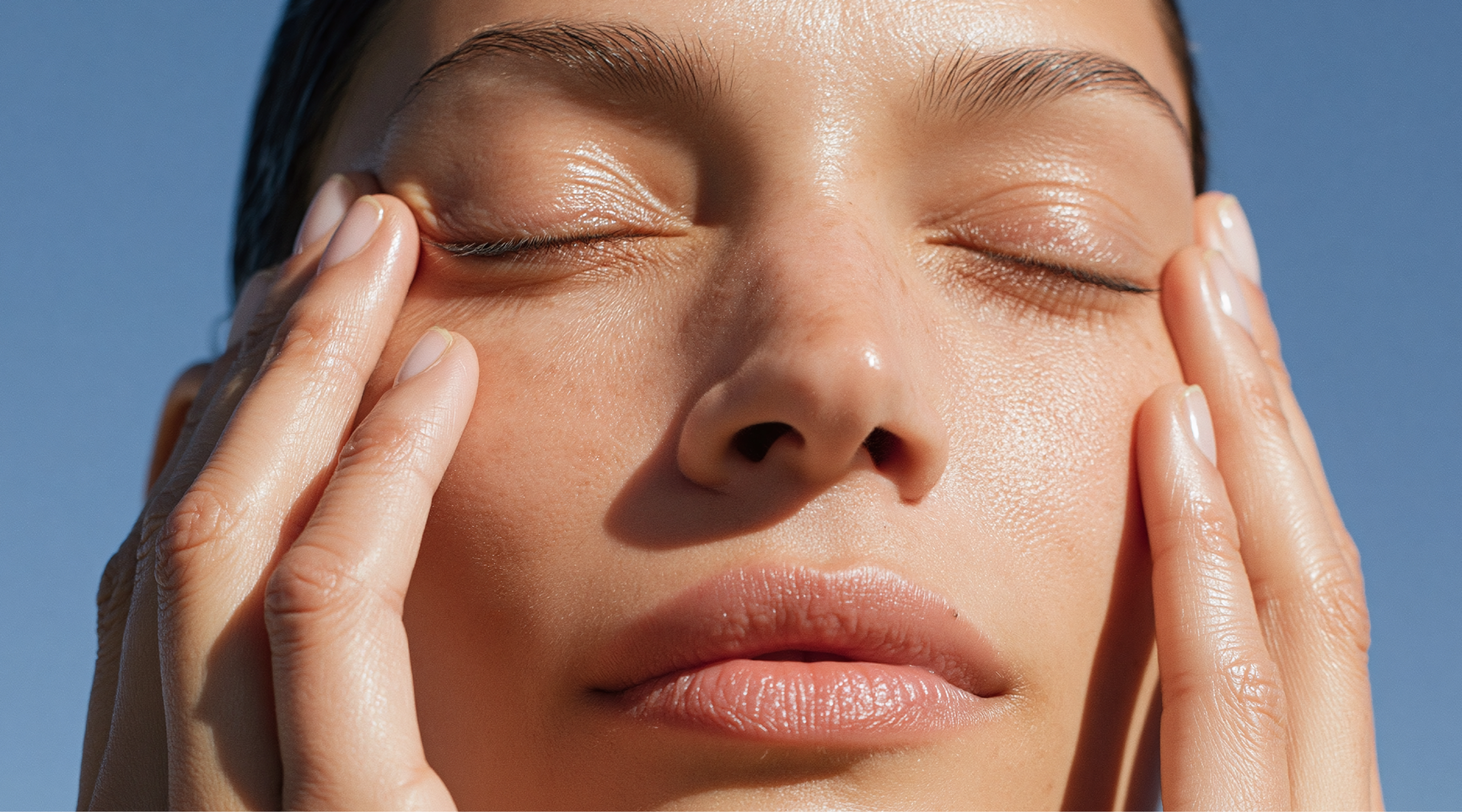 Serene face close up gentle touch under eye skincare routine natural skin glow relaxed expression